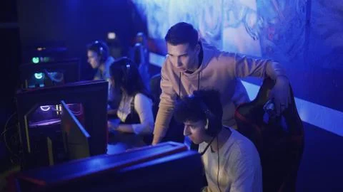 Pro Gamers trainer Explains Strategy to his apprentice Stock Photos