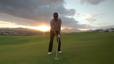 Pro golf swing amazing sunset Stock Footage 10577135