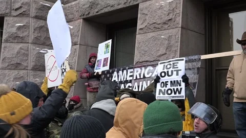 Pro ice right wing activist protesters surrounded by anti-ice protesters Video stock 327868529