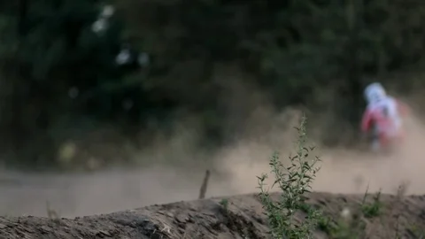 Pro moto cross biker taking a korner Stock Footage 88437475