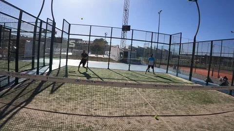 Pro padel player hit padel tennis ball in slow motion at idoor padel court. 動画素材 265176300
