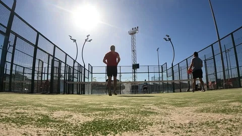 Pro padel player hit padel tennis ball in slow motion at idoor padel court. 库存影片 265176302