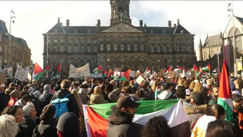 Pro Palestine demonstration crowd in front of palace on Dam Square. Amsterdam. Stock Footage 253632417