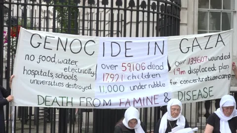 Pro-Palestine protest outside Downing Street as PM convenes urgent meeting on G Video stock 313943777