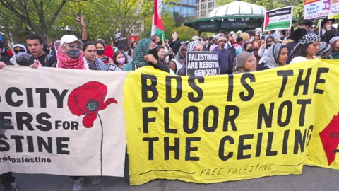 Pro-Palestinian demonstrators march from New York Stock Exchange to Union Square Stock Footage 287794924