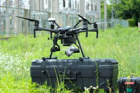 Pro quadcopter with camera and remote control placed on a box before adjustin Foto stock