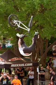 Pro Rider Gets Upside Down Performing BMX Trick In Competition Stock Photos