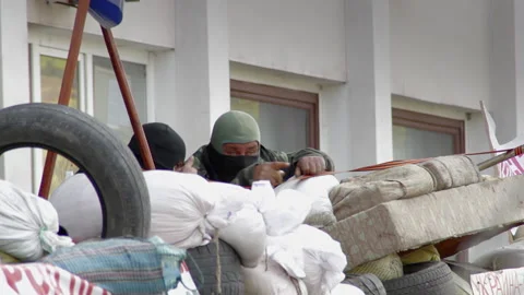 Pro Russian separatists are chatting, occupying a building in Donetsk region Stock Footage 231937373