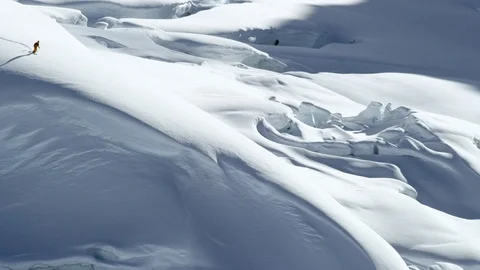 Pro skier skiing down on snowy mountain in slow motion, Tordrillo Mountain Stock Footage 129118530