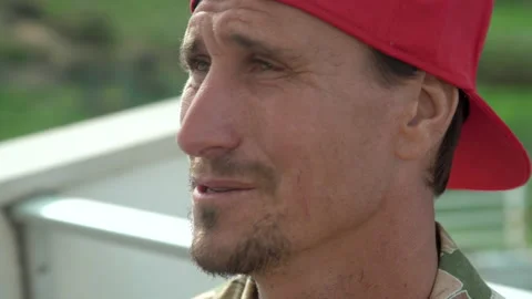 Pro surfer Aaron Gold telling story about big wave breaking situation Stock Footage 150398745