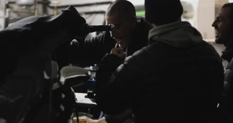 Pro surfer David Langer fixing broken engine of water jet ski in garage Stock Footage 160586437