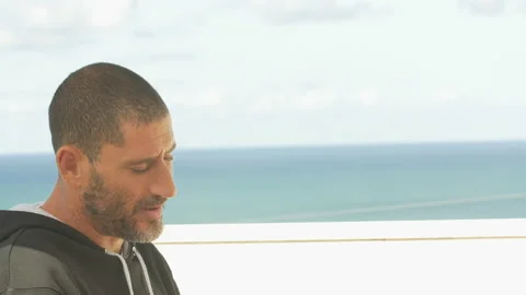 Pro surfer David Langer talking about building skate pool in his backyard Stock Footage 157212572