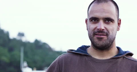 Pro surfer Nuno Santos talking about how he thought he lost violin in ocean Stock Footage 156632706