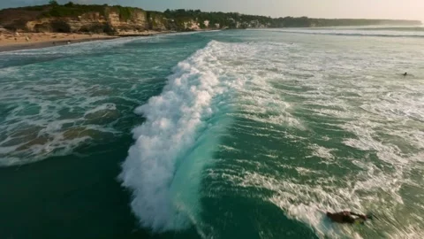 Pro surfer in the ocean in Bali. Slow motion Fpv drone footage Stock-Footage 250454675