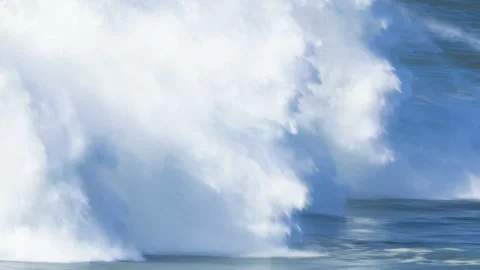 Pro surfer riding in front of huge barrel wave that crashes him into ocean Stock Footage 155662886