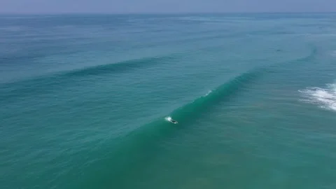 Pro surfer riding a long wave in El Palmar, Spain. Stock Footage 143657324