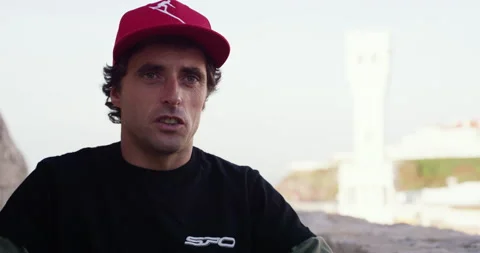 Pro surfer Sergio Cosme talking about his passion for fast driving off roads Stock Footage 156277112