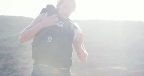 Pro surfer Sergio Cosme trying to zip up Aline Van Haren's safety vest Stock Footage 156615797