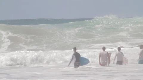 Pro Surfers paddling out at Snapper Rocks,Australia during Cyclone Winston swell Stock Footage 61853054