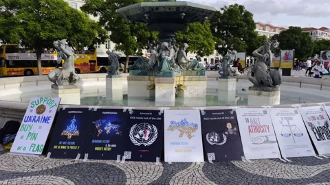 Pro Ukraine Protest Posters Displayed at Lisbon City Fountain In Public Square Stock Footage 330051008