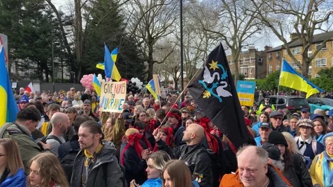 Pro Ukraine protesters at demonstration, march to the Russian Embassy in London. Stock Footage 302832913