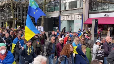 Pro Ukraine protesters at demonstration, march to the Russian Embassy in London. Stock Footage 302832983