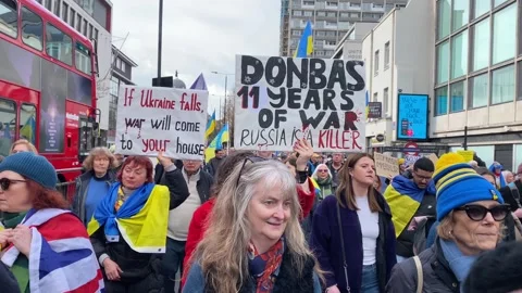 Pro Ukraine protesters at demonstration, march to the Russian Embassy in London. Stock Footage 302833004
