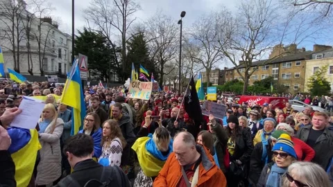 Pro Ukraine protesters at demonstration, march to the Russian Embassy in London. Stock Footage 302833005