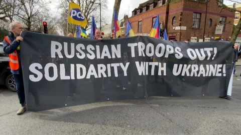Pro Ukraine protesters at demonstration, march to the Russian Embassy in London. Stock Footage 303017301