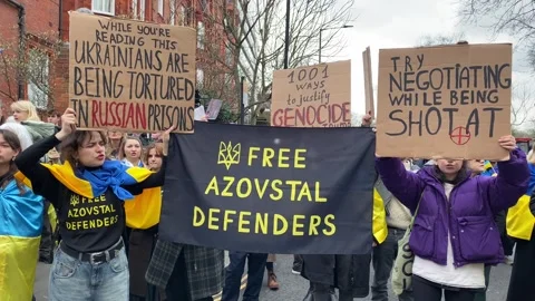 Pro Ukraine protesters at demonstration, march to the Russian Embassy in London. Stock Footage 303070930