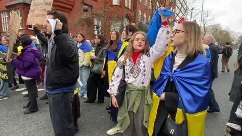 Pro Ukraine protesters at demonstration, march to the Russian Embassy in London. Stock Footage 303070943