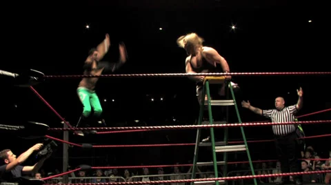 Pro Wrestling Move: Top Rope Dropkick off Ladder Stock Footage 33598459