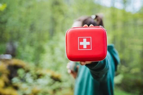 Proactive emergency preparedness in nature with a first aid kit for outdoor.. Stock Photos
