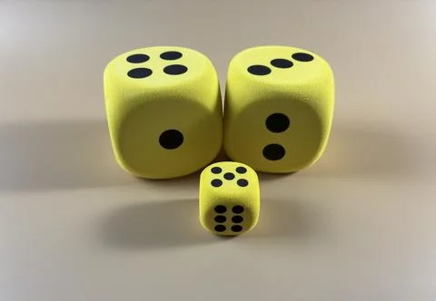 Probability and Luck Concept with Three Yellow Dice 库存照片