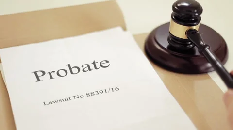 Probate lawsuit documets folder with gavel placed on desk of judge in court Stock Footage 59560465