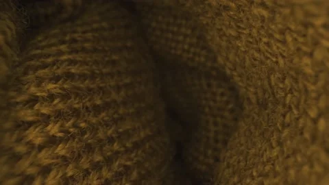 Probe lens inside yellow wool scarf close up moving Stock Footage