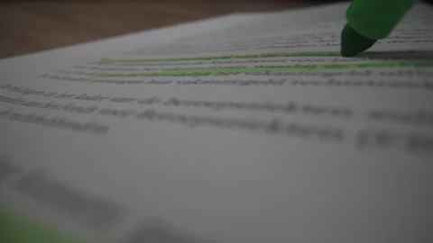 Probe lens macro book green marker closeup text Stock Footage 124015223