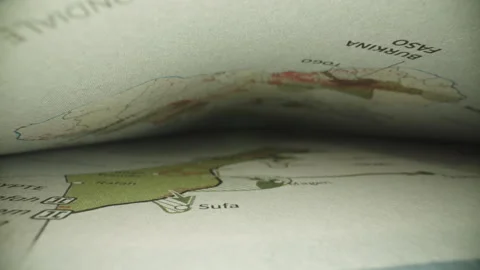 Probe Lens View of Gaza Map Inside Curved Geography Book Stock Footage 338015256
