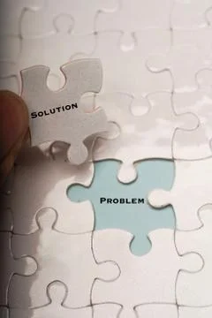 Problem and solution wordings on puzzle pieces Stock Photos