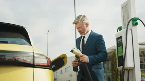 Problem with charging an electric car, different connection cables. Handsome Stock Footage 235227866