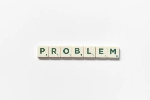Problem formed of scrabble tiles on white background. Stock Photos