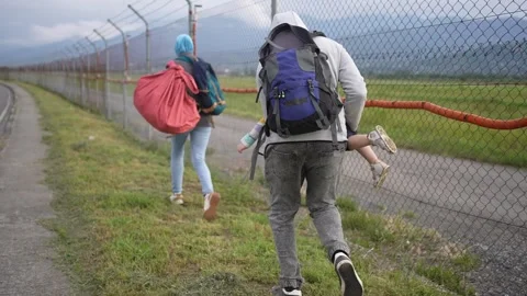 Problem an illegal immigrant or an undocumented person a refugee family is Stock Footage 252642458