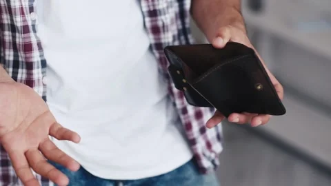 Problem person man holding and open empty wallet, purse no have money bill Video stock 336450420