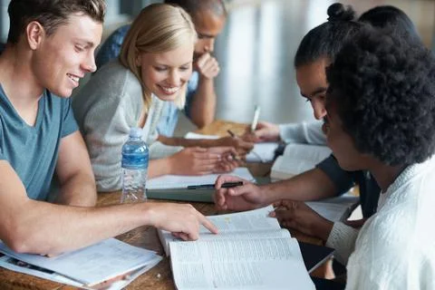 This problem is relatively simple...A group of college students sitting together Stock Photos