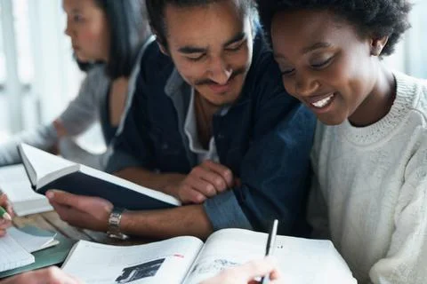 This problem is relatively simple...A group of college students sitting together Stock Photos