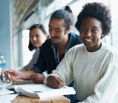 This problem is relatively simple...A group of college students sitting together Foto stock