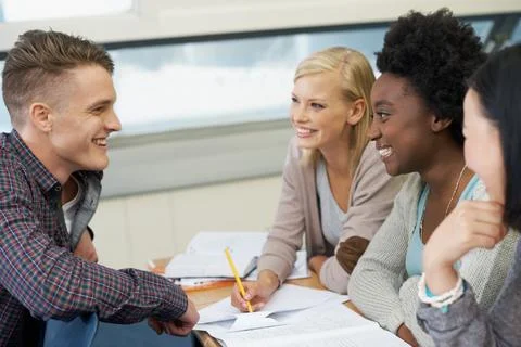 This problem is relatively simple...A group of college students sitting together Foto stock