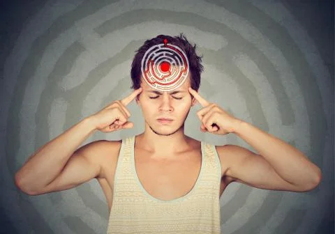 Problem solution concept. Young puzzled man isolated on gray wall background Stock Photos