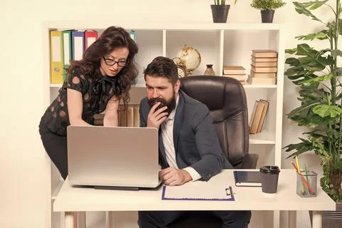 Problem solving. Business partners work on computer. Communication and IT skills Stock Photos