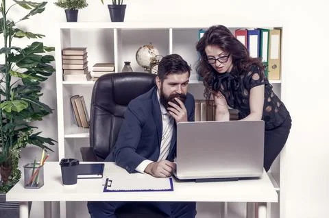 Problem solving. Business partners work on computer. Communication and IT skills Stock Photos